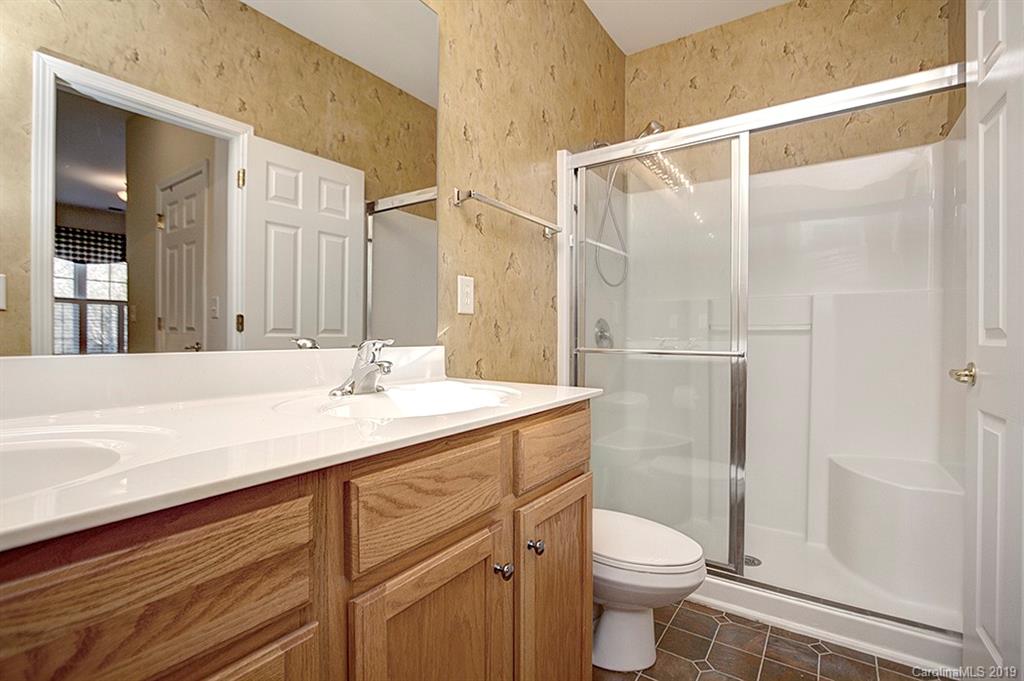 407 Garnet Court Fort Mill, SC 29708 - Photo 14 of 30 a bathroom with a sink a toilet and shower