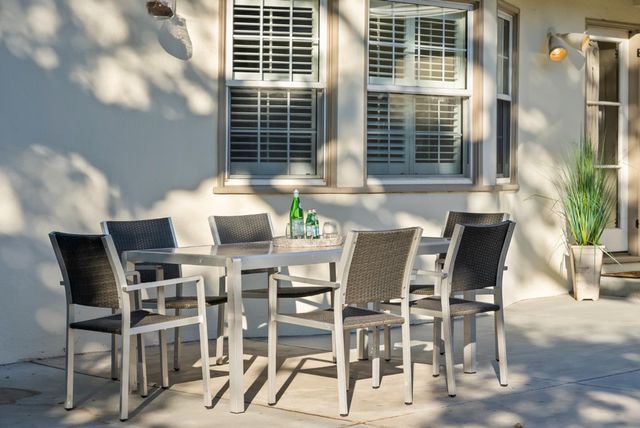 a view of a dining room with furniture and window