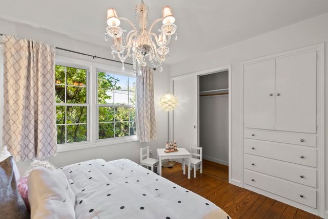 a bedroom with a bed and a table