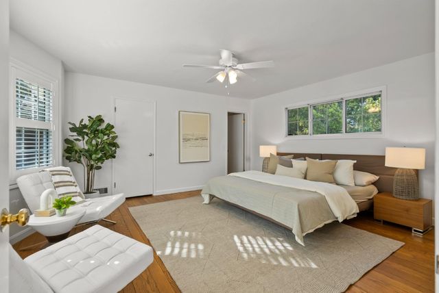 a bedroom with bed and window