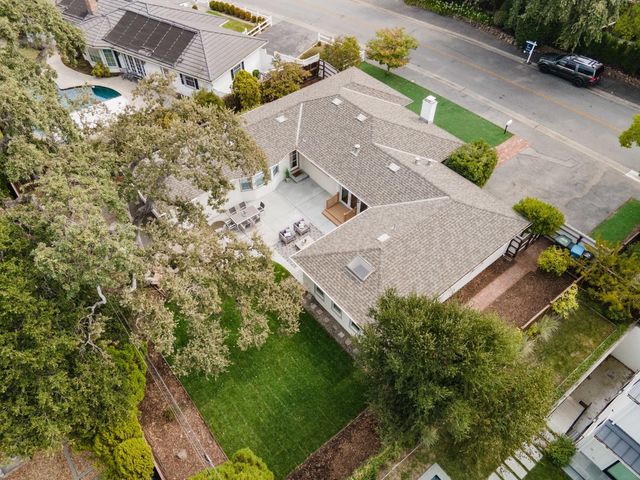 an aerial view of residential houses with outdoor space