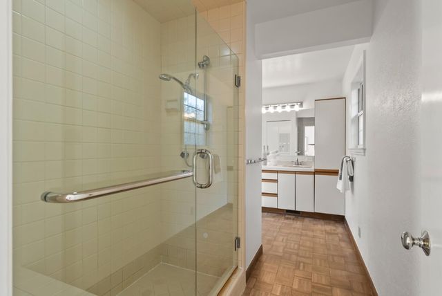a bathroom with a double vanity sink and a mirror