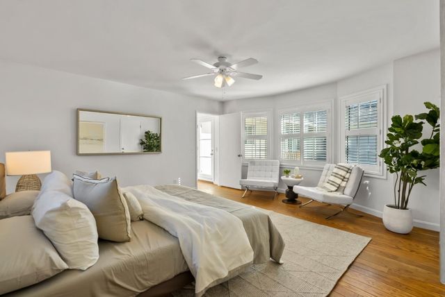 a bedroom with a balcony a bed and a couch