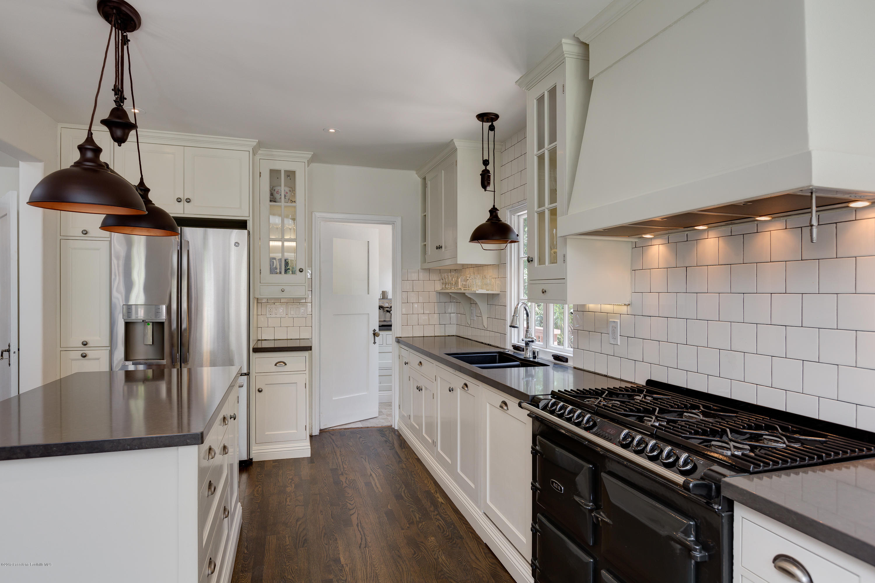 2529 Marengo Avenue Altadena, CA 91001 - Photo 19 of 42 a kitchen with granite countertop a sink stove and refrigerator