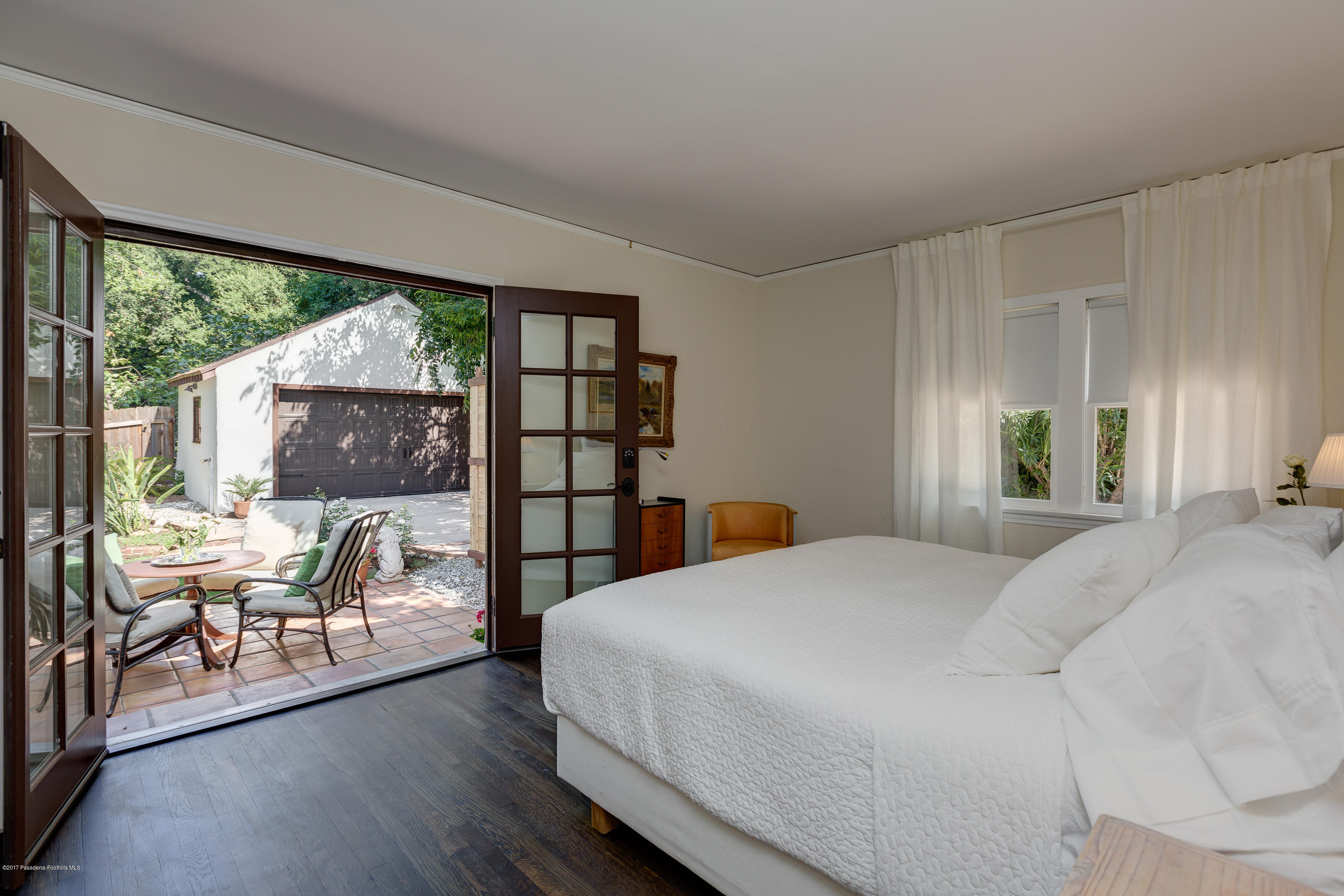 2529 Marengo Avenue Altadena, CA 91001 - Photo 32 of 42 a bedroom with a large bed and a balcony