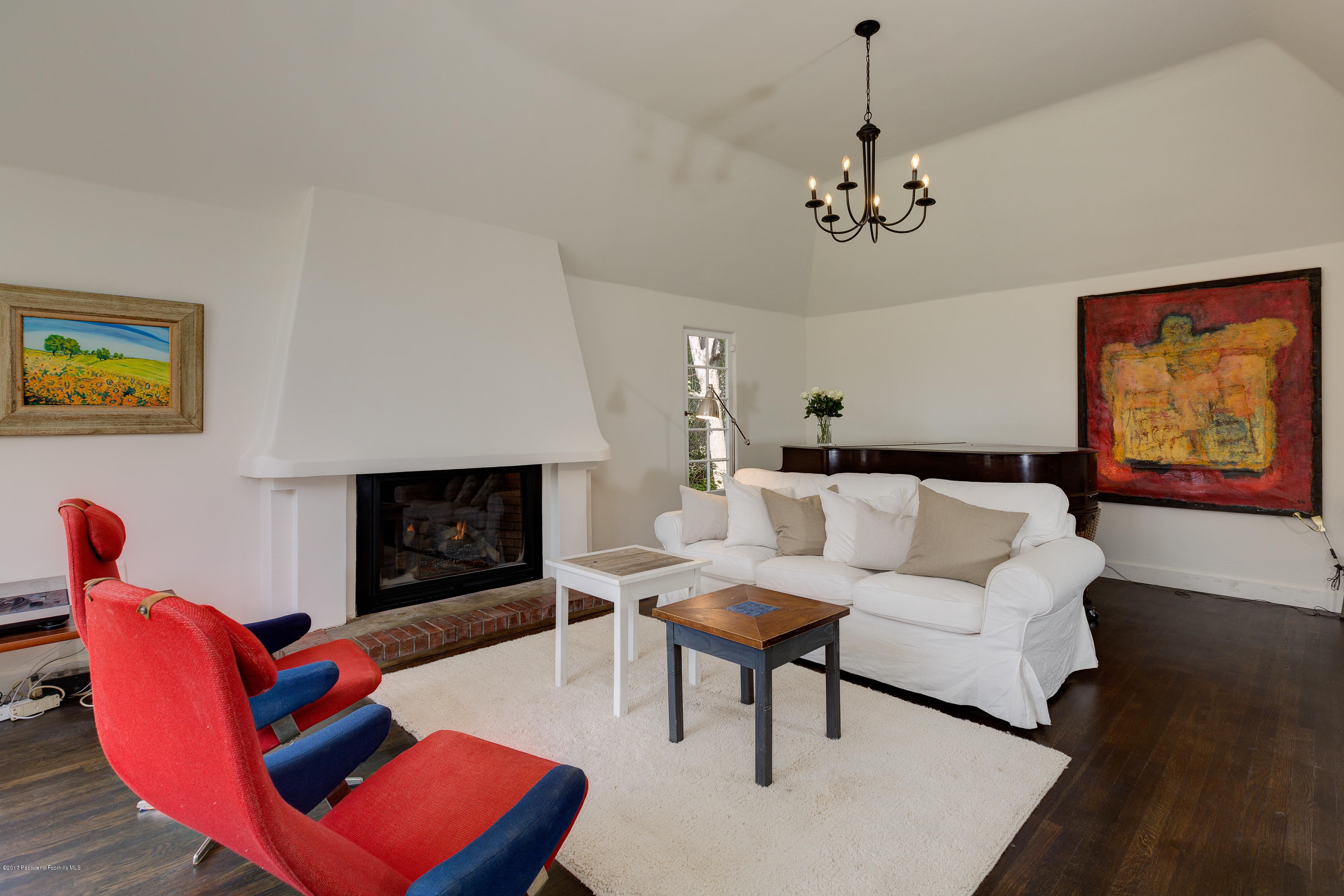 2529 Marengo Avenue Altadena, CA 91001 - Photo 10 of 42 a living room with furniture a flat screen tv and a fireplace