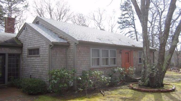 65 Upper Marsh Road Wellfleet, MA 02667 - Photo 1 of 24 a view of a house with a yard and large tree