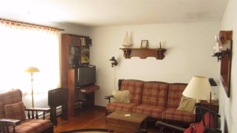 65 Upper Marsh Road Wellfleet, MA 02667 - Photo 13 of 24 a living room with furniture and a lamp