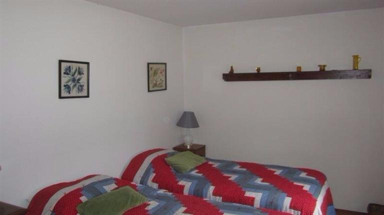 65 Upper Marsh Road Wellfleet, MA 02667 - Photo 19 of 24 a bedroom with a bed and a lamp on dresser