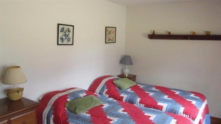 65 Upper Marsh Road Wellfleet, MA 02667 - Photo 20 of 24 a bedroom with a bed and a lamp