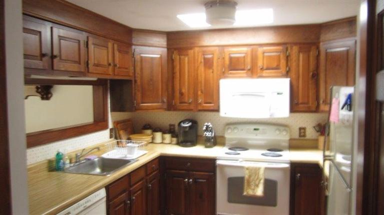 65 Upper Marsh Road Wellfleet, MA 02667 - Photo 7 of 24 a kitchen with stainless steel appliances granite countertop a sink stove and refrigerator