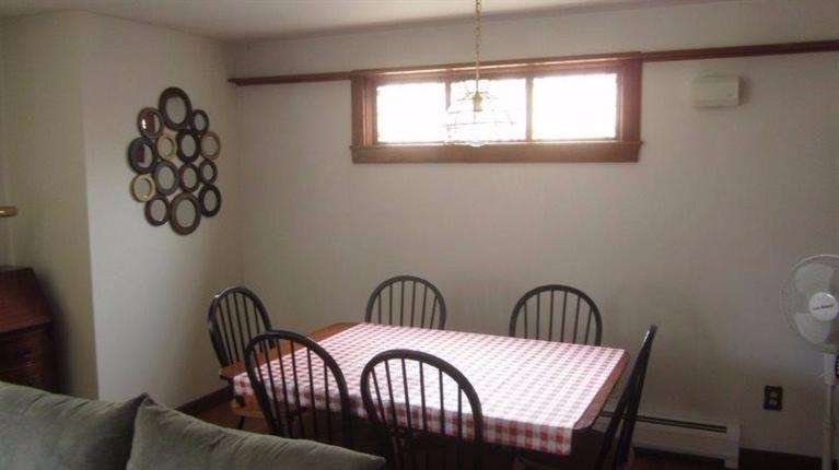 65 Upper Marsh Road Wellfleet, MA 02667 - Photo 8 of 24 a view of a dining room with furniture and window