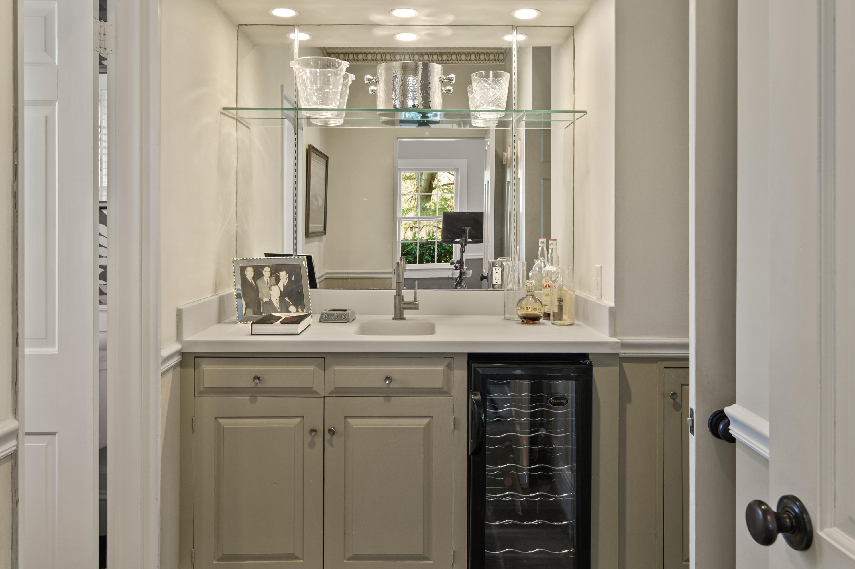 469 Brookside Road New Canaan, CT 06840 - Photo 18 of 39 a bathroom with a double vanity sink and a mirror