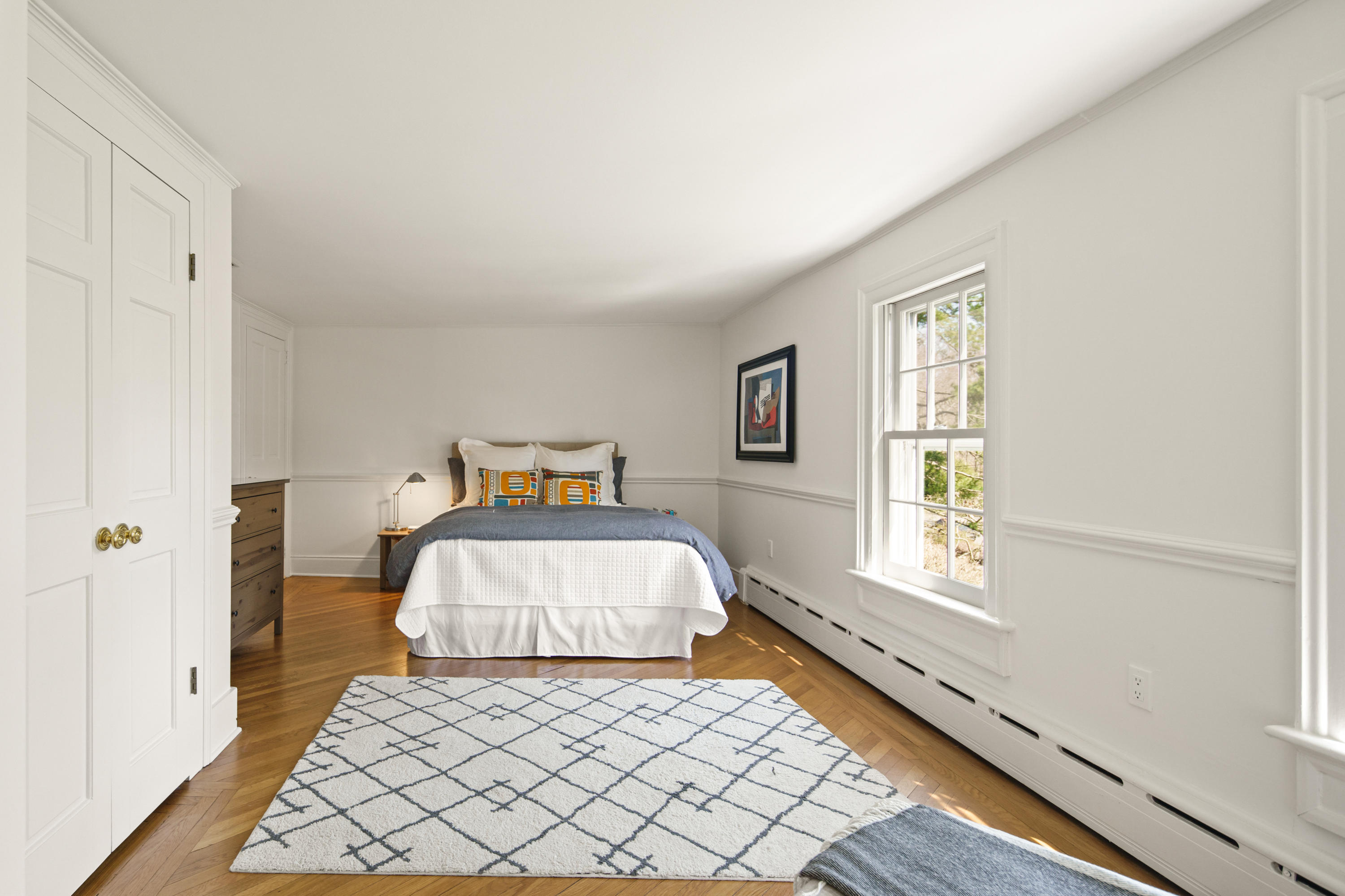 469 Brookside Road New Canaan, CT 06840 - Photo 23 of 39 a bedroom with a bed and window