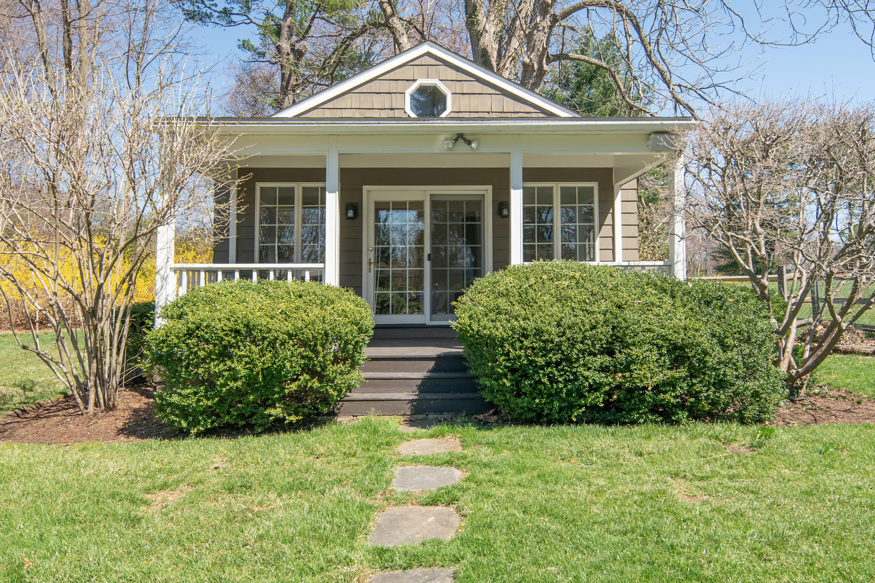 469 Brookside Road New Canaan, CT 06840 - Photo 33 of 39 a front view of a house with garden