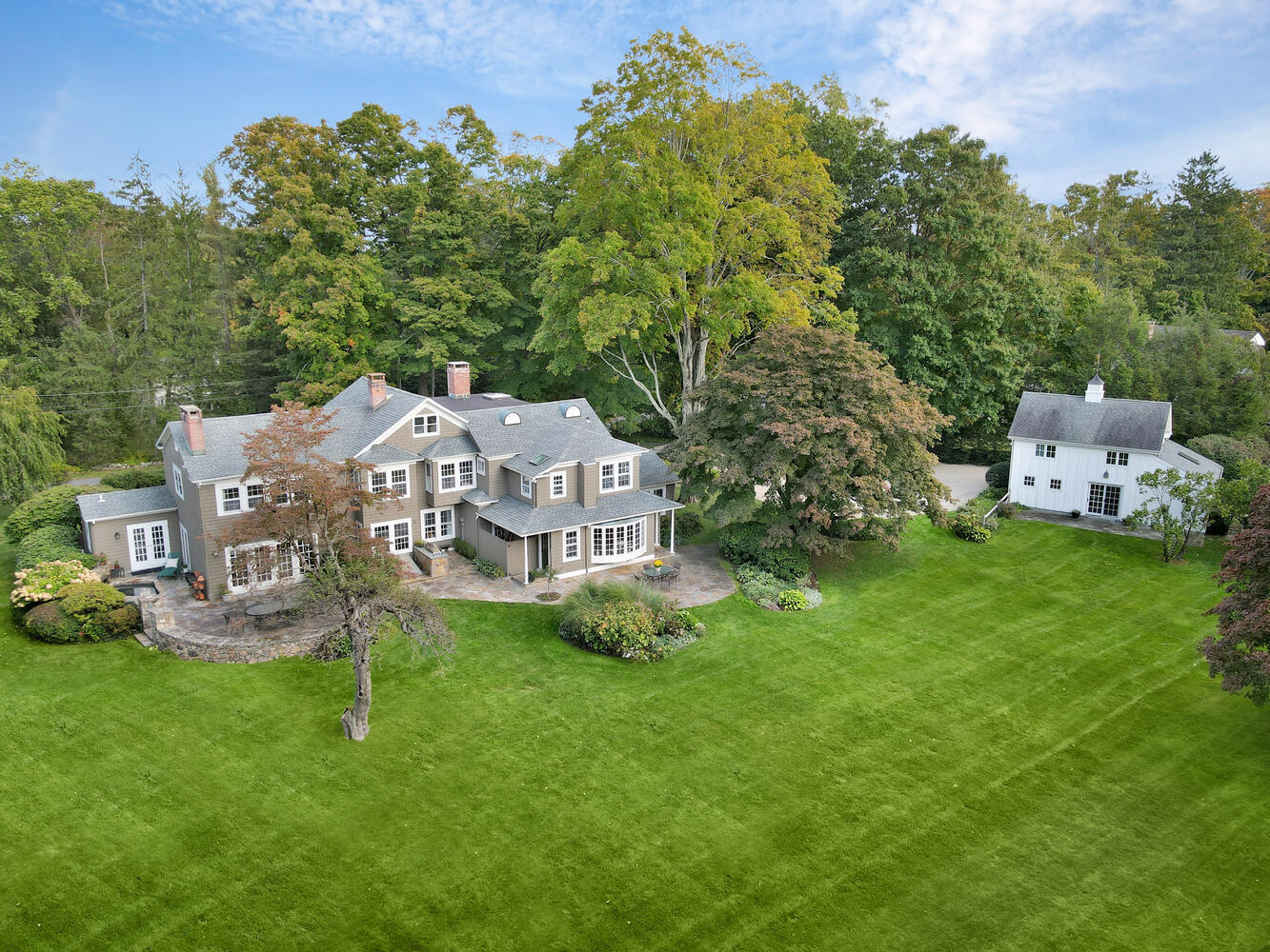 469 Brookside Road New Canaan, CT 06840 - Photo 35 of 39 a aerial view of a house with backyard garden and trees