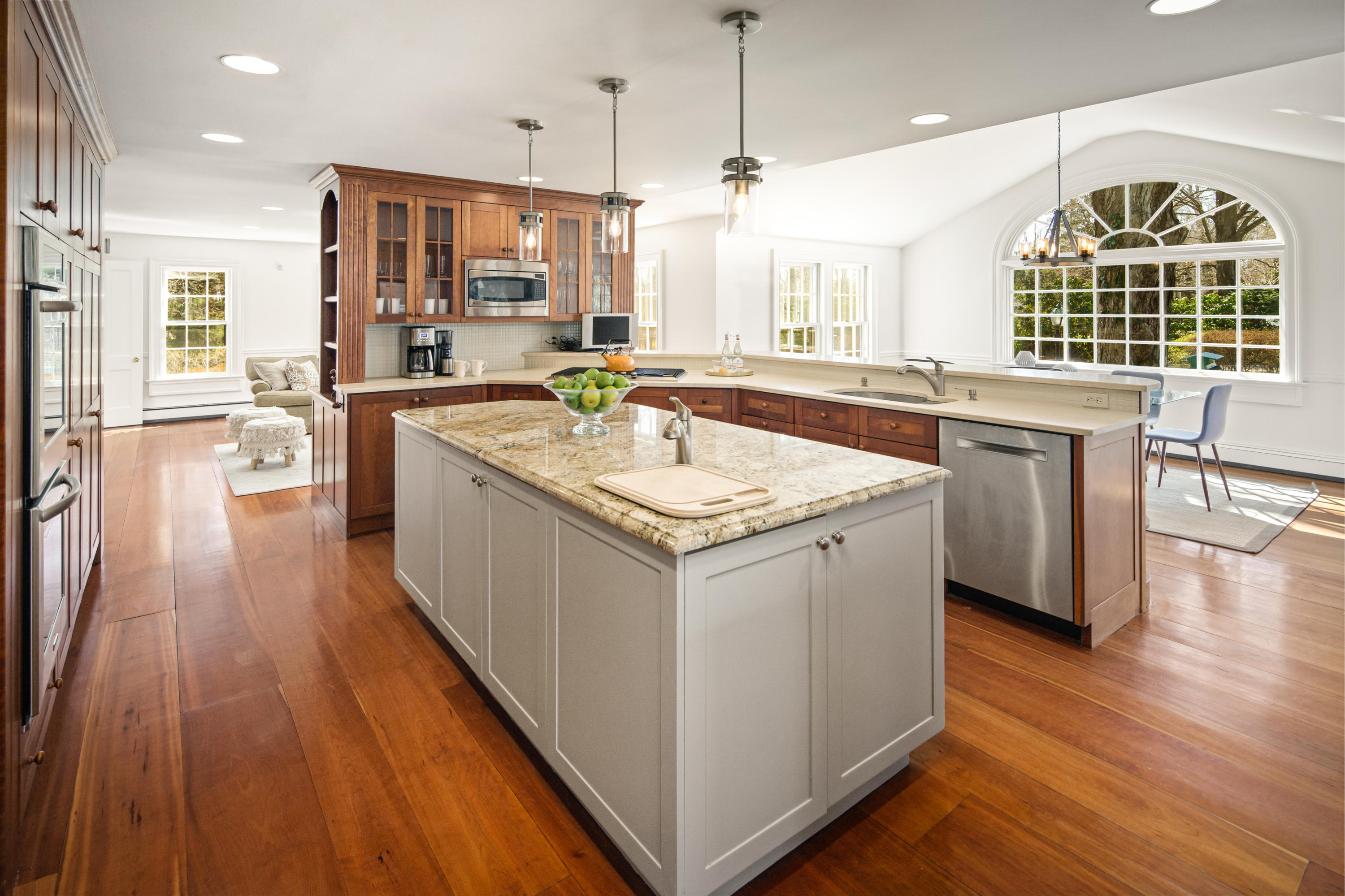 469 Brookside Road New Canaan, CT 06840 - Photo 9 of 39 a kitchen with a sink stove and wooden floor