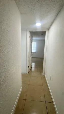 a white toilet sitting next to a bath tub