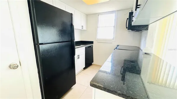 a kitchen with a stove and a microwave