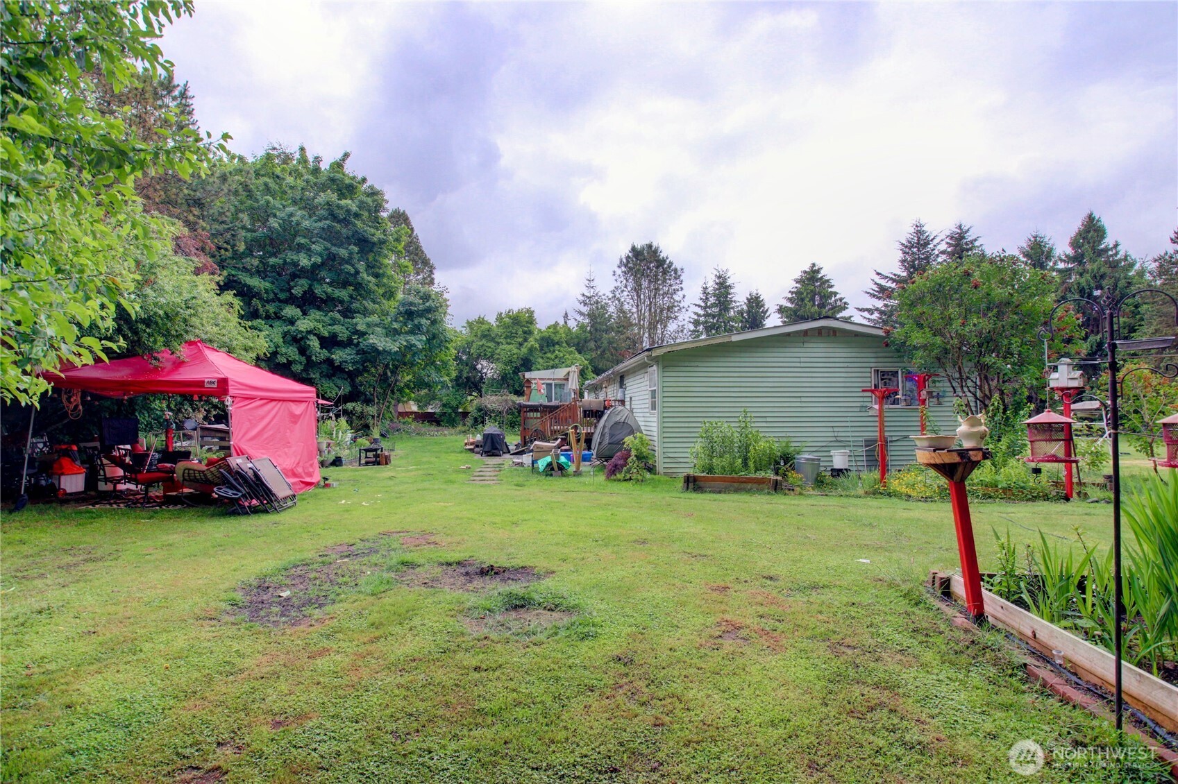 7185 Old Highway 99 North Road Burlington, WA 98233 - Photo 17 of 26 a view of a house with a yard and sitting area