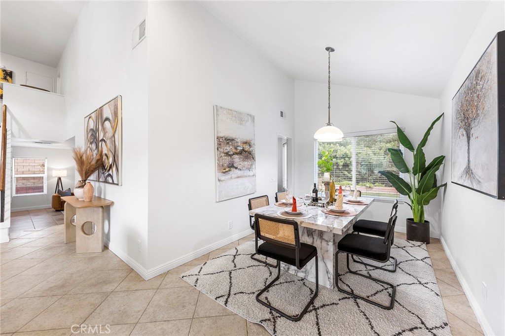 39 Viewpoint Circle Pomona, CA 91766 - Photo 13 of 49 a dining room with furniture and a potted plant
