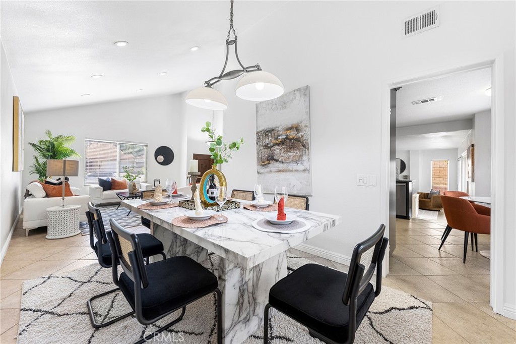 39 Viewpoint Circle Pomona, CA 91766 - Photo 15 of 49 a view of a dining room with furniture and a chandelier