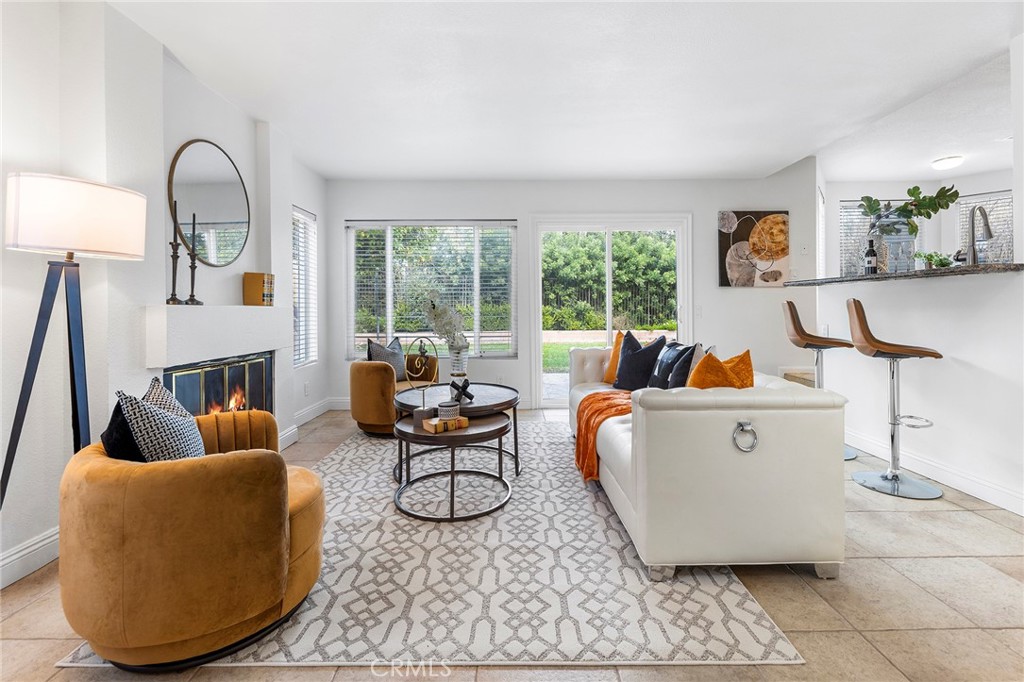 39 Viewpoint Circle Pomona, CA 91766 - Photo 17 of 49 a living room with furniture a fireplace and a large window