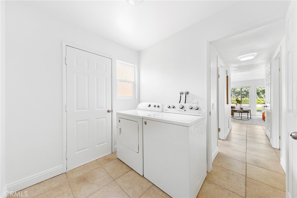 39 Viewpoint Circle Pomona, CA 91766 - Photo 27 of 49 a utility room with cabinets washer and dryer