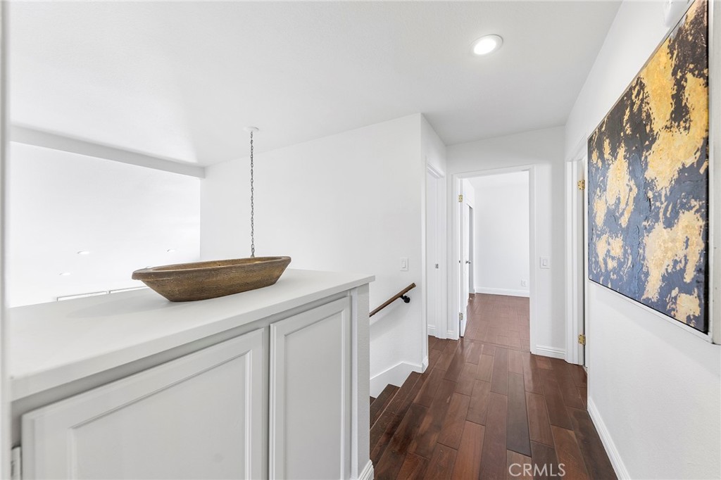 39 Viewpoint Circle Pomona, CA 91766 - Photo 30 of 49 a kitchen with cabinets and wooden floor