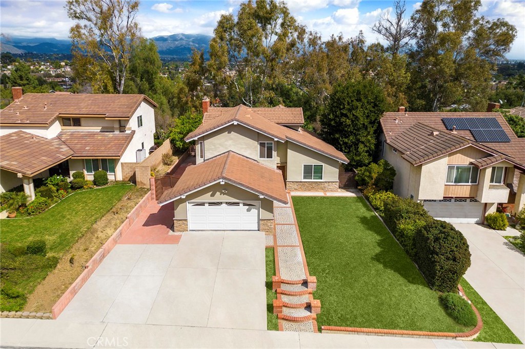 39 Viewpoint Circle Pomona, CA 91766 - Photo 3 of 49 a front view of a house with a yard