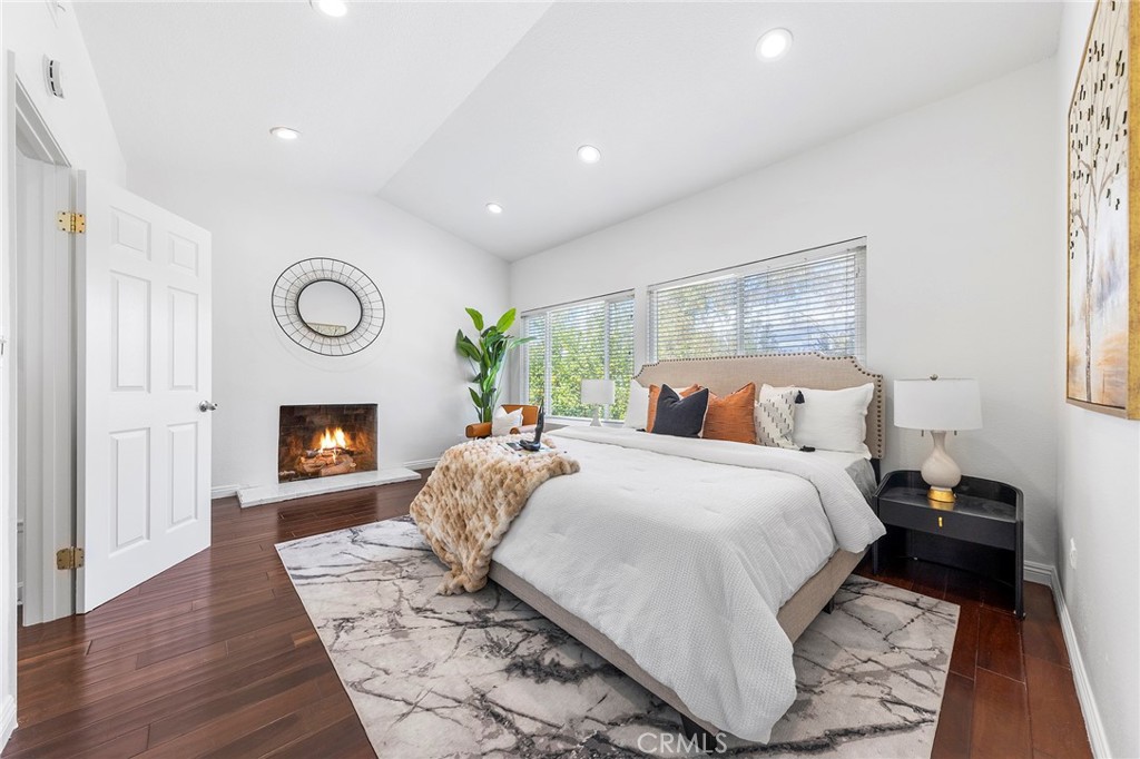 39 Viewpoint Circle Pomona, CA 91766 - Photo 33 of 49 a bed room with a bed and a fireplace