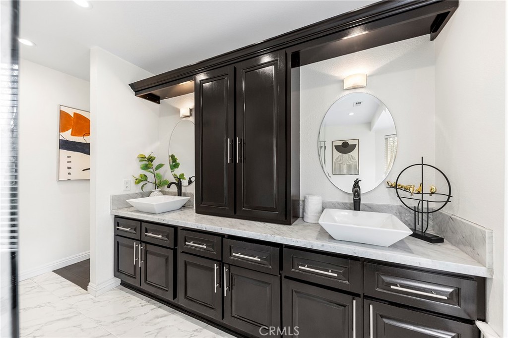 39 Viewpoint Circle Pomona, CA 91766 - Photo 35 of 49 a bathroom with a sink and a mirror