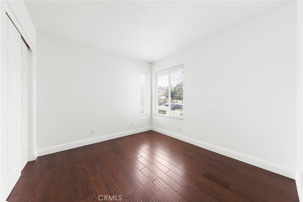 39 Viewpoint Circle Pomona, CA 91766 - Photo 39 of 49 an empty room with wooden floor and windows