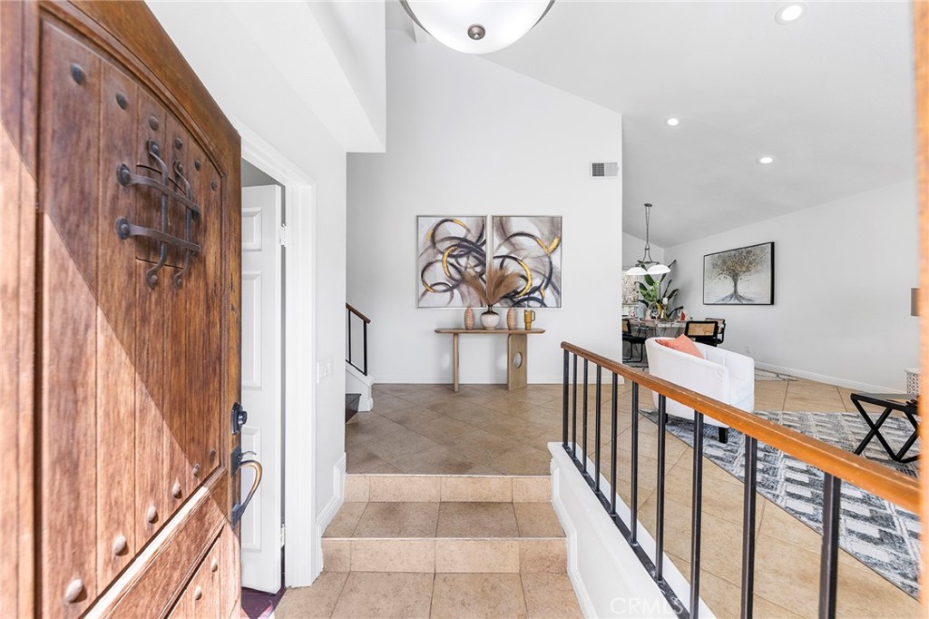 39 Viewpoint Circle Pomona, CA 91766 - Photo 6 of 49 a view of a hallway with wooden floor and stairs