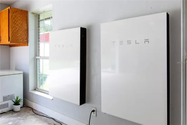 a white refrigerator freezer sitting inside of a kitchen