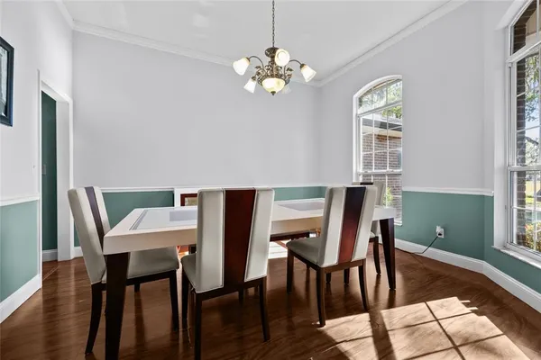 a view of a dining room with furniture and window
