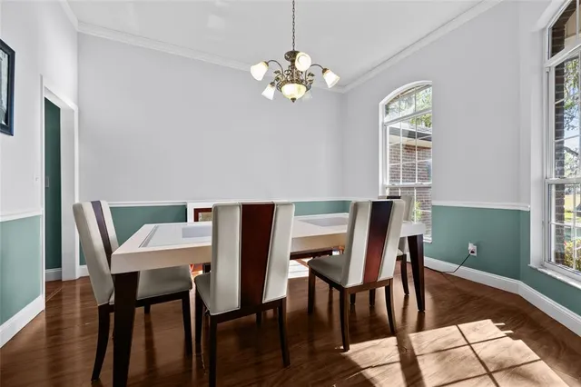 a view of a dining room with furniture and window