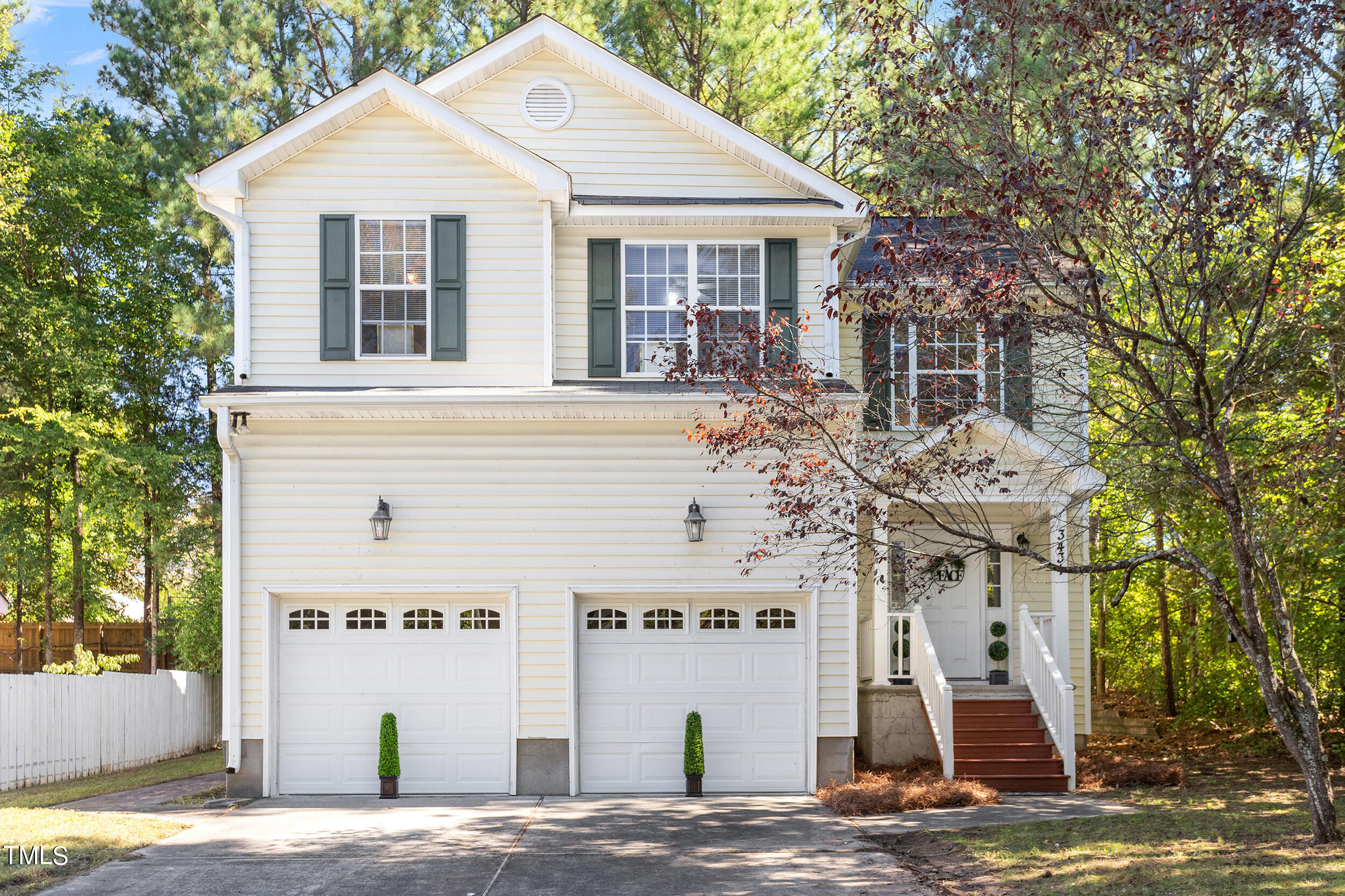 3431 Old Chapel Hill Road Durham, NC 27707 - Photo 1 of 3 a view of a white house with large trees