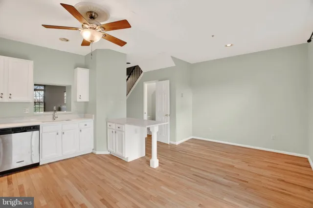 a bedroom with a bed dresser and a window