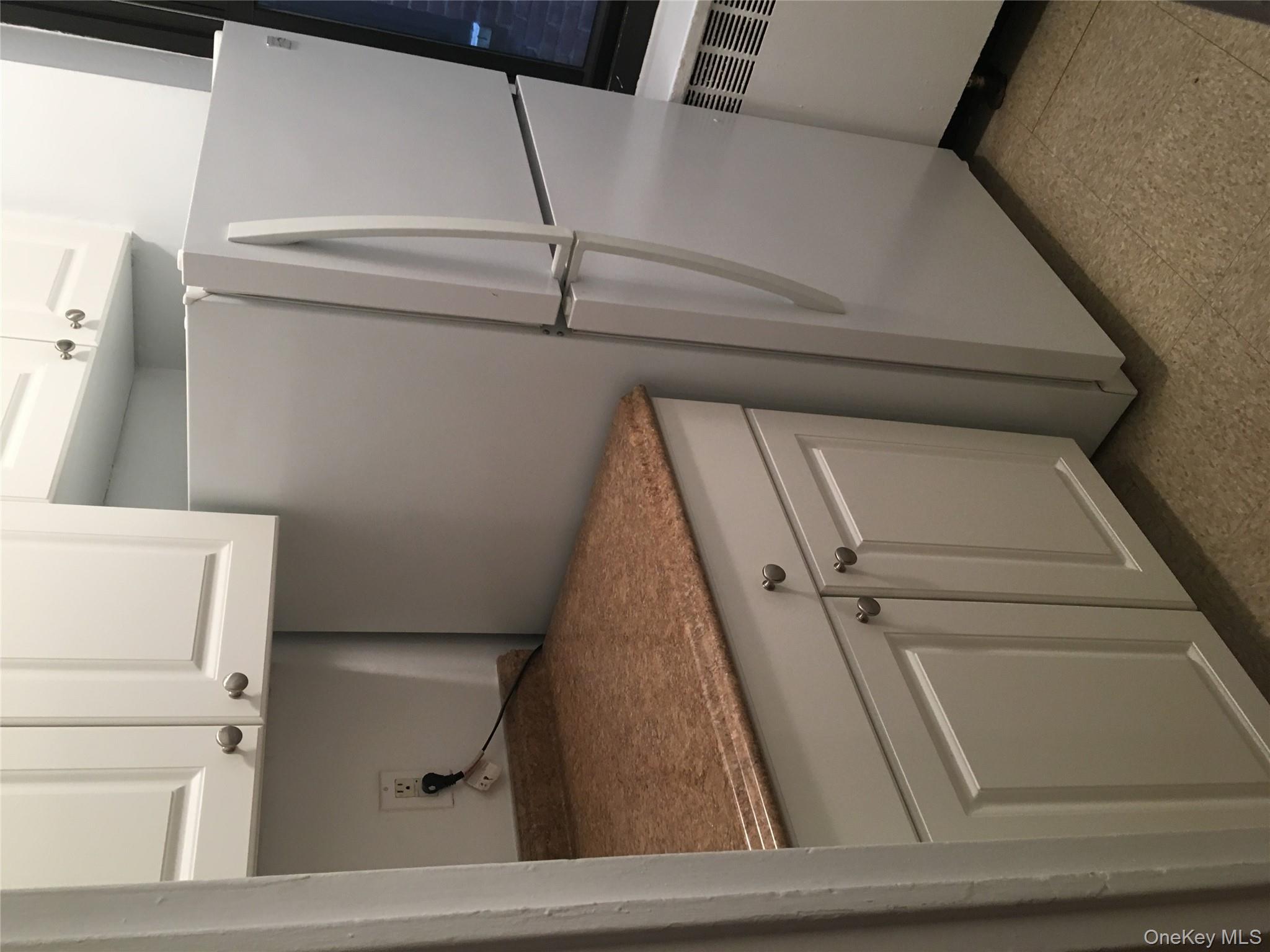 23 Schenck Avenue, Unit 1BD Great Neck, NY 11021 - Photo 6 of 14 a utility room with dryer and washer