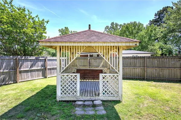 a view of a back yard of the house