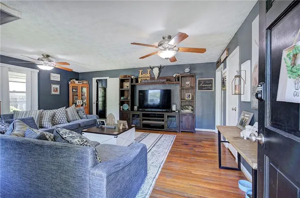 a living room with furniture and a flat screen tv