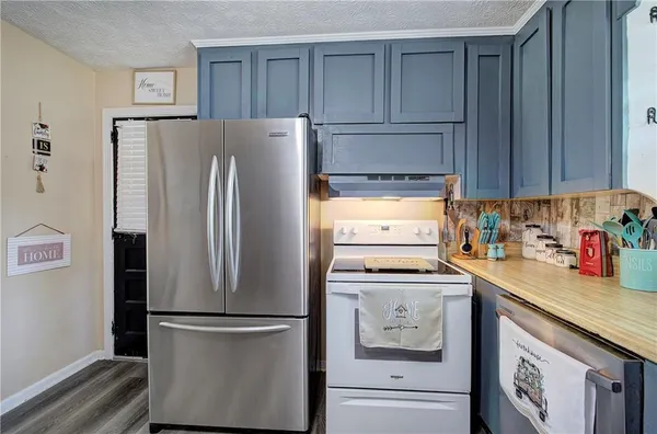 a kitchen with a table and chairs in it
