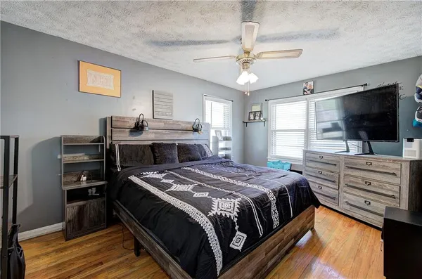 a view of a hallway view with wooden floor and staircase
