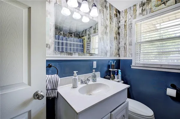 a room with wooden floor and window