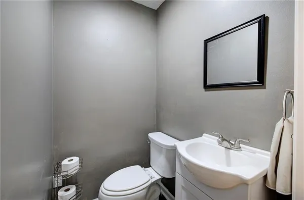 a bedroom with a bed and a table in it with window