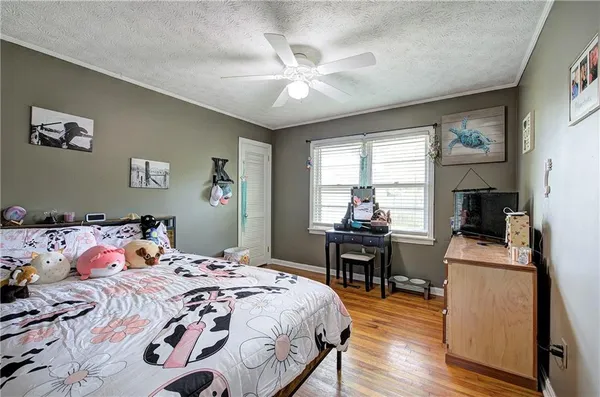 an aerial view of a house with garden space and lake view