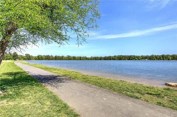 a view of a swimming pool with a lake view