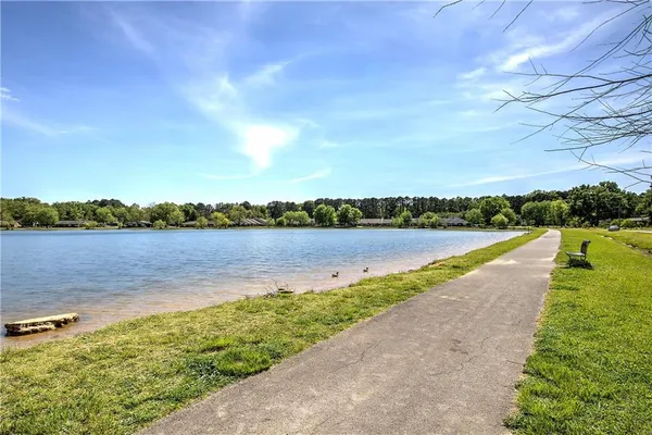 an aerial view of a house with yard swimming pool and outdoor seating