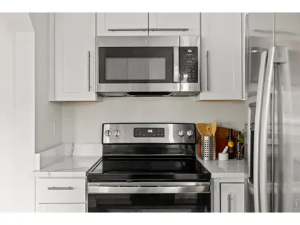a kitchen with appliances and cabinets